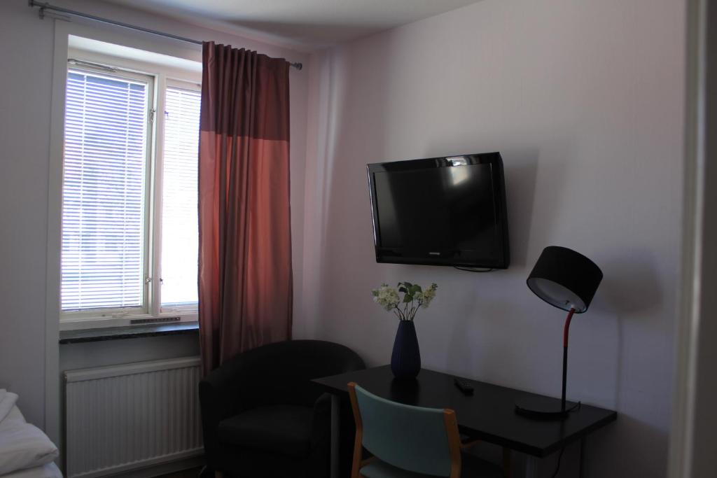 TV a/nebo společenská místnost v ubytování Hotel Tre Stockar