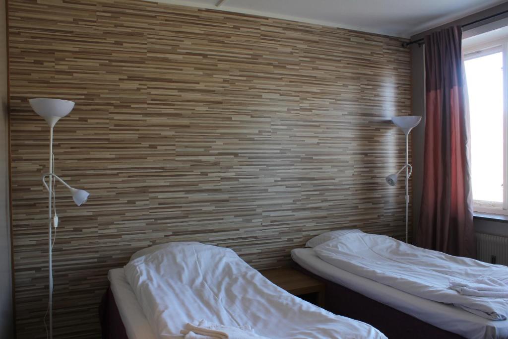 Postel nebo postele na pokoji v ubytování Hotel Tre Stockar