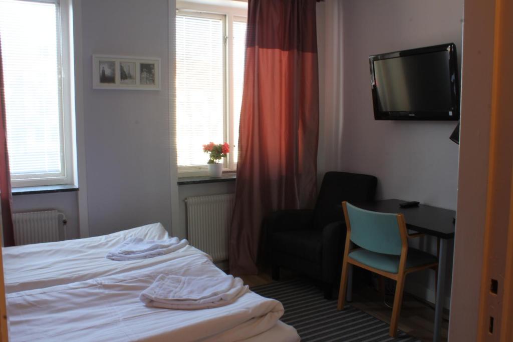 Postel nebo postele na pokoji v ubytování Hotel Tre Stockar