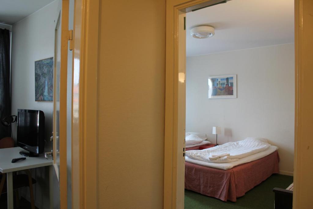 Postel nebo postele na pokoji v ubytování Hotel Tre Stockar