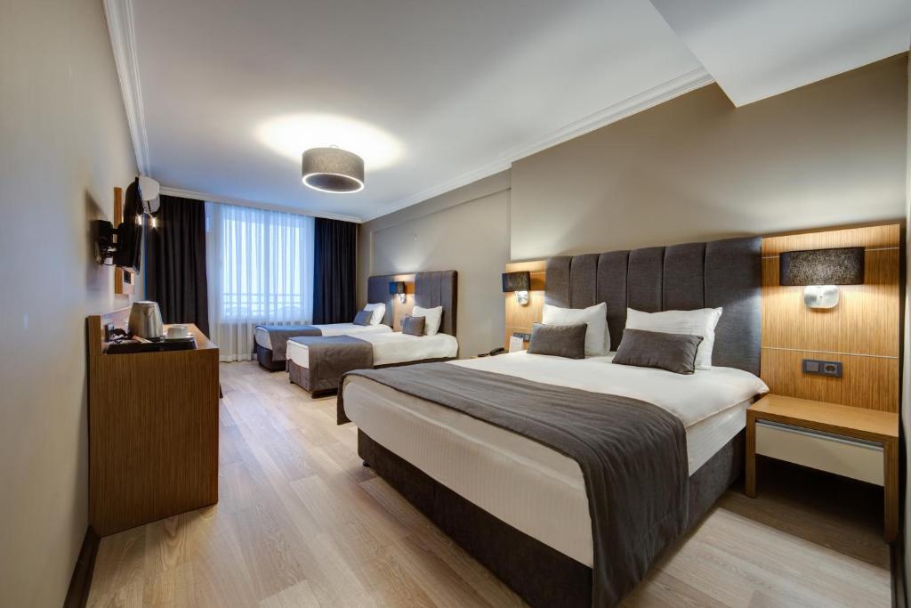 Postel nebo postele na pokoji v ubytování Sahil Martı Hotel