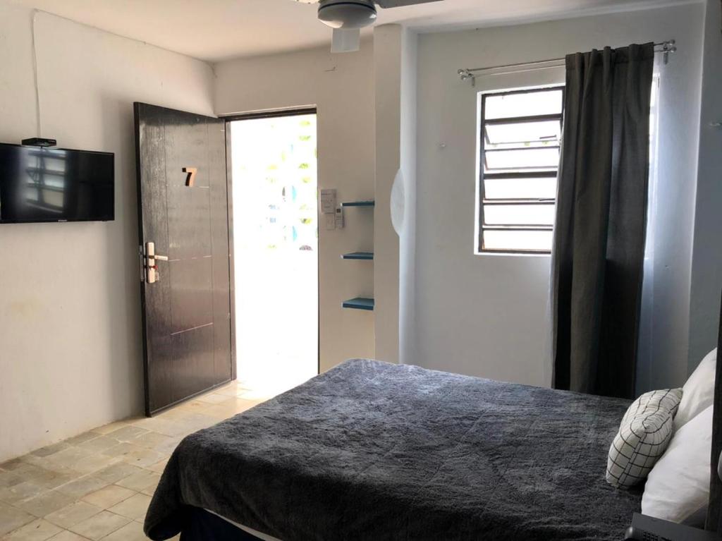 Llit o llits en una habitació de Suites del Sureste - Mérida