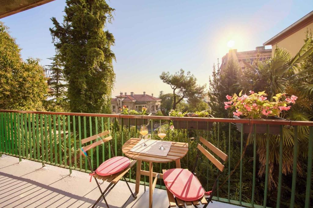 a patio with a table and chairs on a balcony at Apartment in Rijeka 38182 in Rijeka