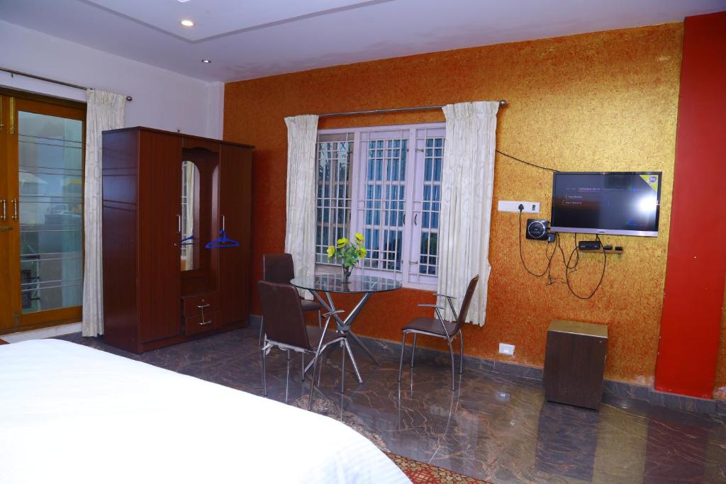 TV a/nebo společenská místnost v ubytování Celestial Resorts