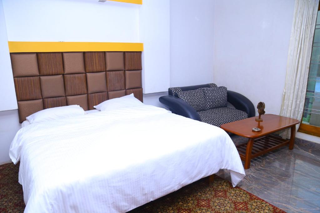 Postel nebo postele na pokoji v ubytování Celestial Resorts