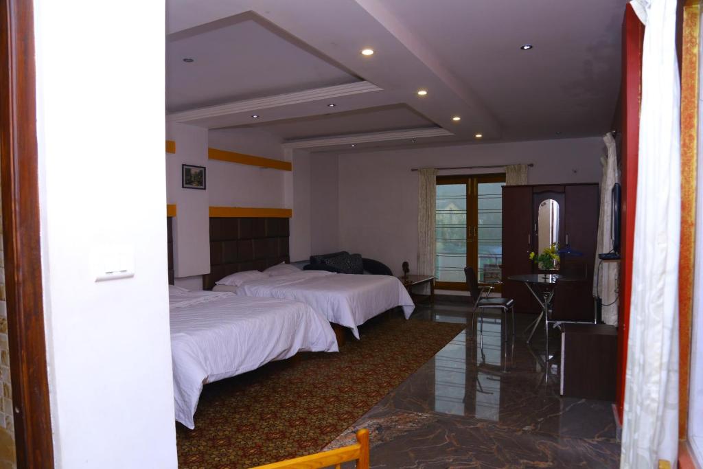 Postel nebo postele na pokoji v ubytování Celestial Resorts