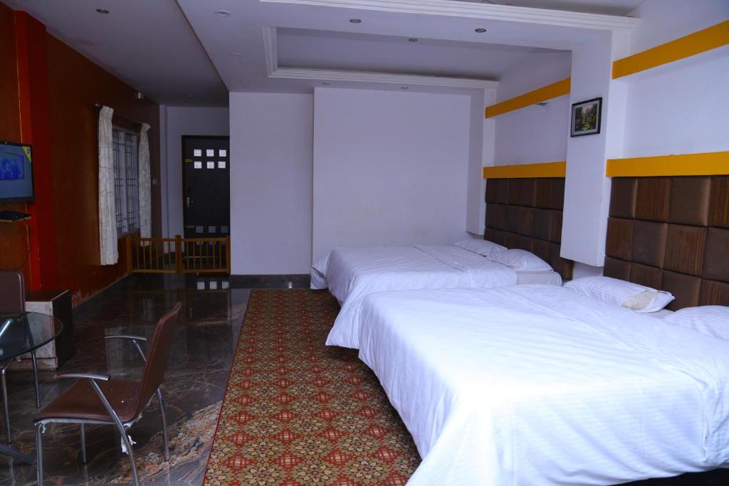 Postel nebo postele na pokoji v ubytování Celestial Resorts