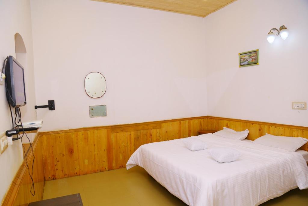Postel nebo postele na pokoji v ubytování Celestial Resorts