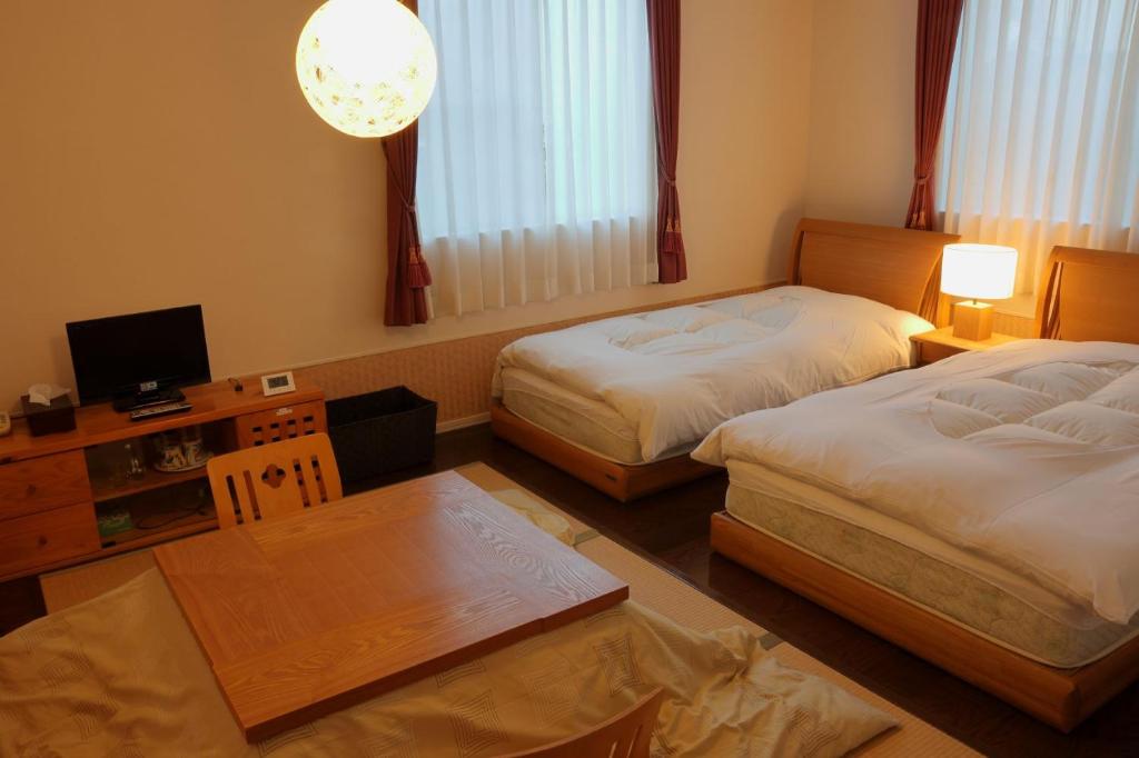 Postel nebo postele na pokoji v ubytování RokuRoku