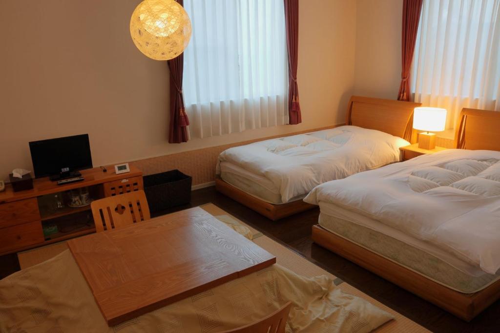 Postel nebo postele na pokoji v ubytování RokuRoku