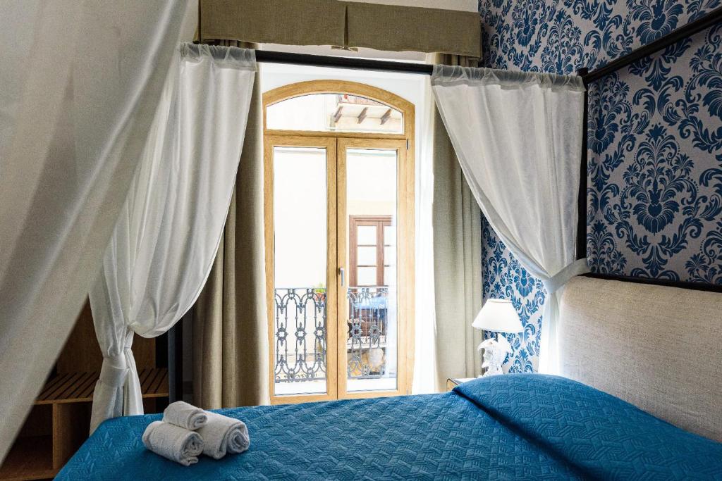Łóżko lub łóżka w pokoju w obiekcie Incao Holiday I Pupi House