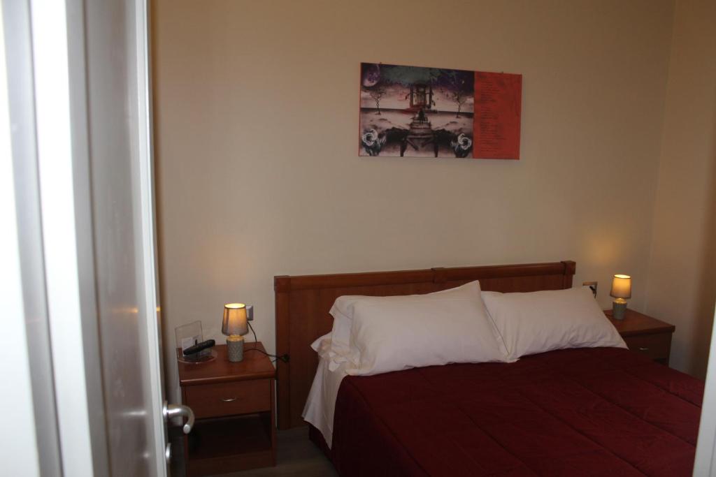 Postel nebo postele na pokoji v ubytování Hotel Il Casale
