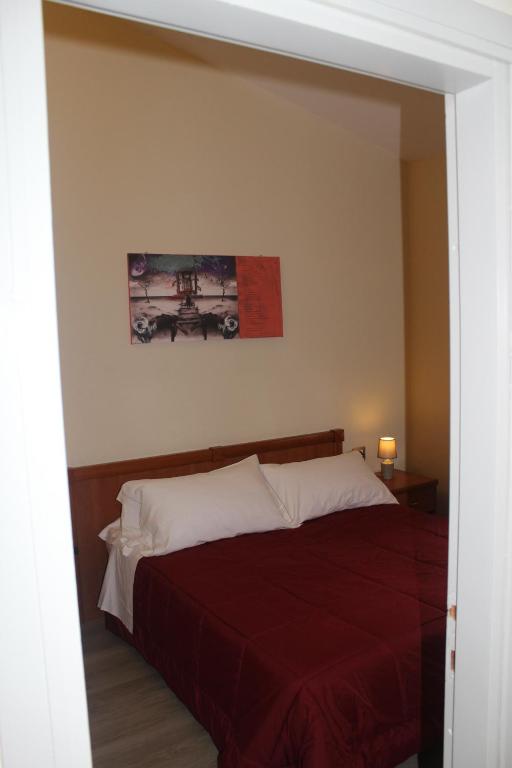 Postel nebo postele na pokoji v ubytování Hotel Il Casale