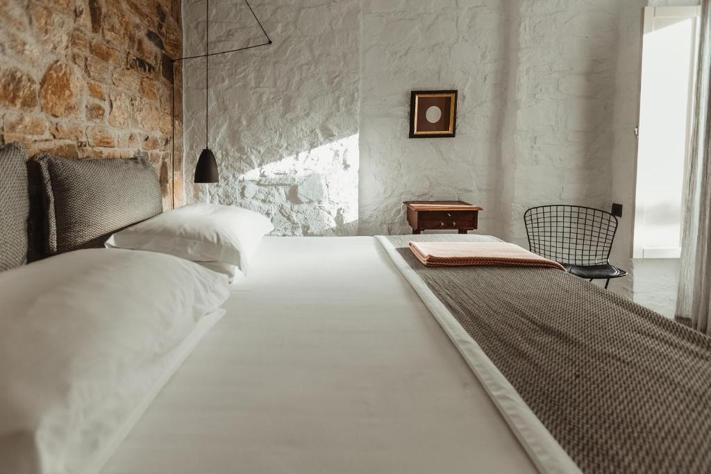 Postel nebo postele na pokoji v ubytování Ayiopetra Exclusive Getaways