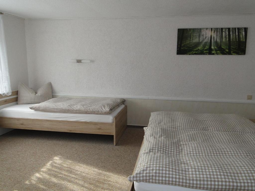 Cama ou camas em um quarto em Haus Angermann