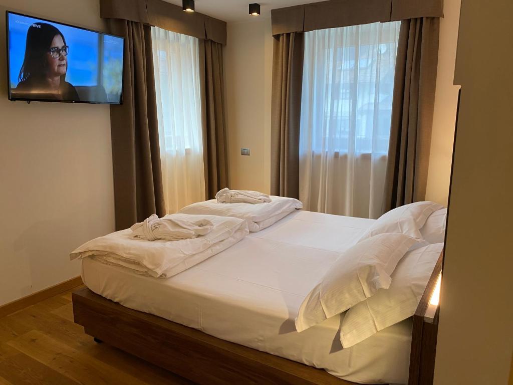 Posteľ alebo postele v izbe v ubytovaní Dolomeet Boutique Hotel
