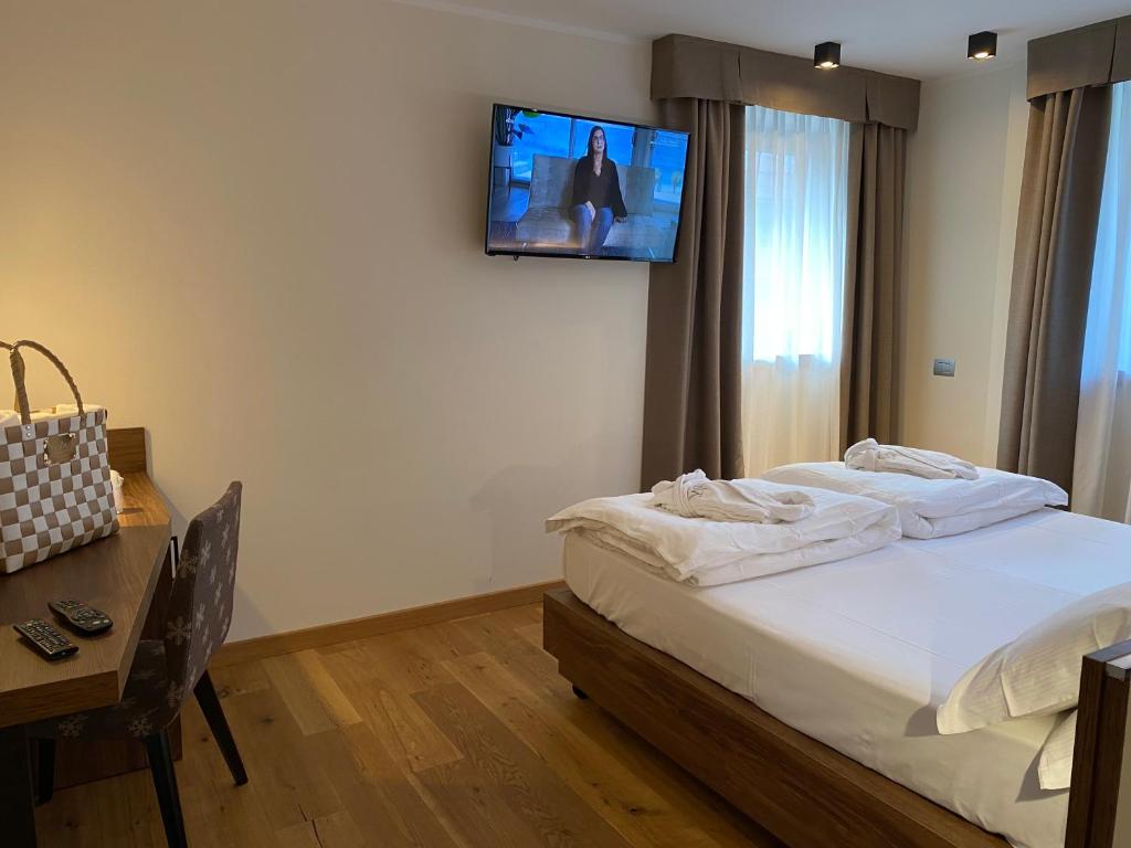 Posteľ alebo postele v izbe v ubytovaní Dolomeet Boutique Hotel