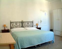 A bed or beds in a room at Hotel Aldobrandini