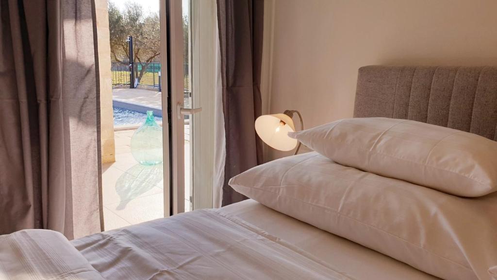 Postel nebo postele na pokoji v ubytování Ferienhaus Rovinj mit Pool
