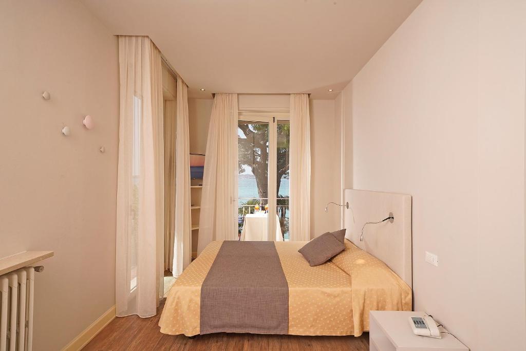 Postel nebo postele na pokoji v ubytování Hotel Marconi
