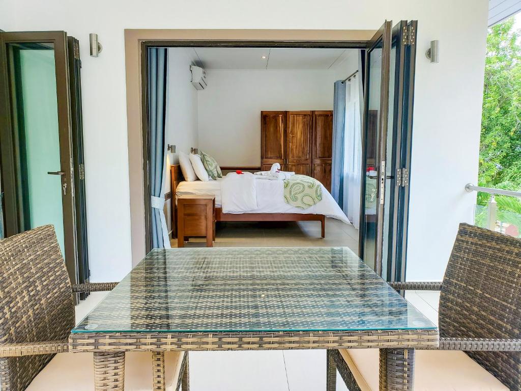 Postel nebo postele na pokoji v ubytování Palm Holiday Apartments