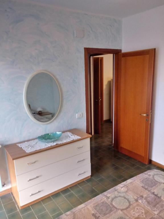 a bathroom with a sink and a mirror on the wall at Caletta Beach in Castiglioncello