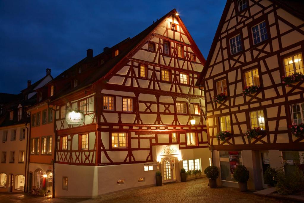 a couple of half timbered buildings at night at Boutique Hotel 3 Stuben in Meersburg