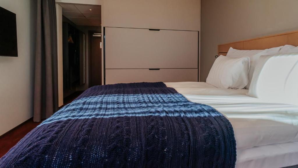 Postel nebo postele na pokoji v ubytování Quality Hotel The Weaver