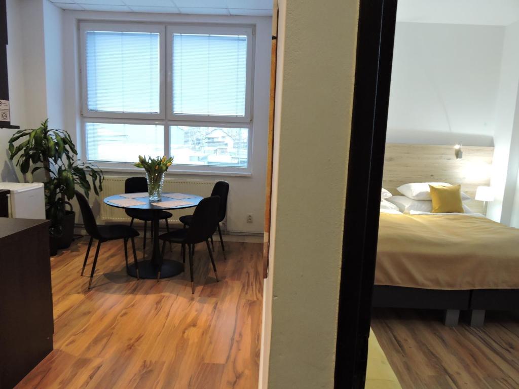 A bed or beds in a room at Primma Hotel