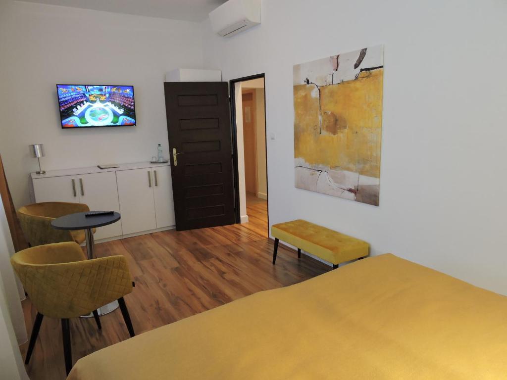 A bed or beds in a room at Primma Hotel