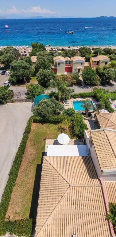 an aerial view of a house and the ocean at Vivere Apartment Barbati Beach in Barbati