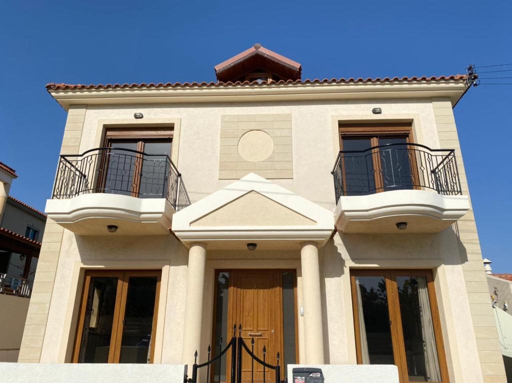 a house with two balconies on top of it at EPISKOPI VILLA, Luxury 4 Bedroom with Pool - Limassol in Limassol