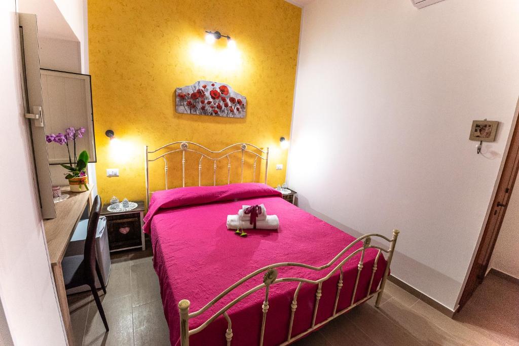 Postel nebo postele na pokoji v ubytování La Scalinata