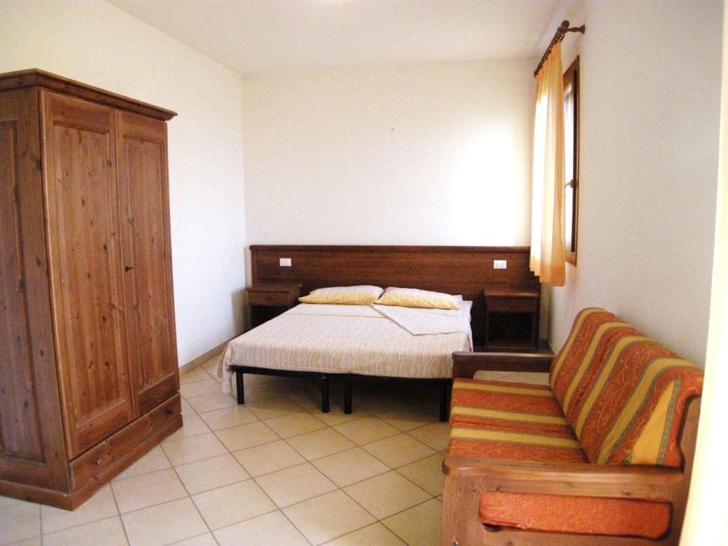 A bed or beds in a room at Apartments in Ariano nel Polesine 24954