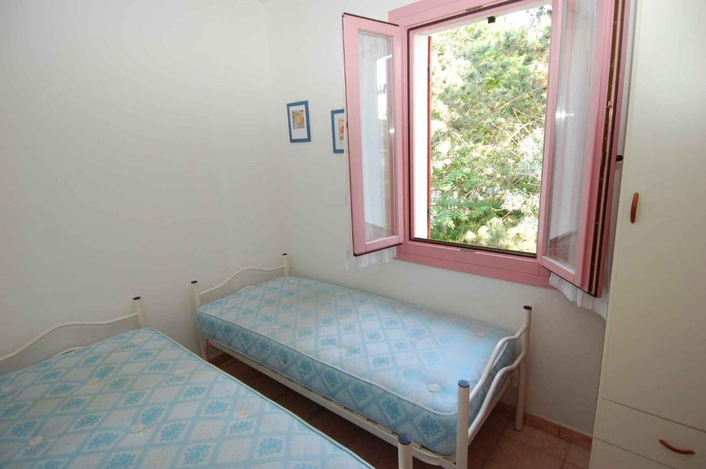 Posteľ alebo postele v izbe v ubytovaní Apartment in Rosolina Mare 24888