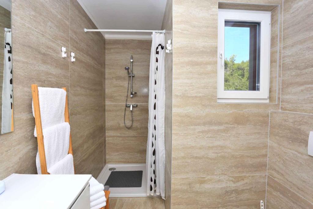 Kúpeľňa v ubytovaní Holiday home in Kukljica
