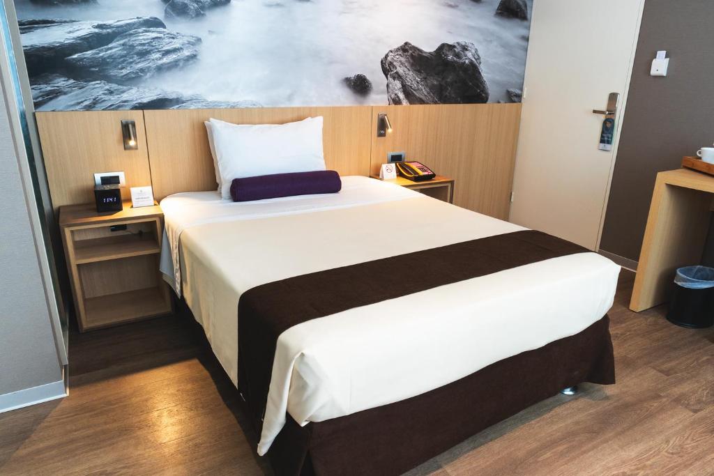 Katil atau katil-katil dalam bilik di Palmetto Hotel Business San Borja