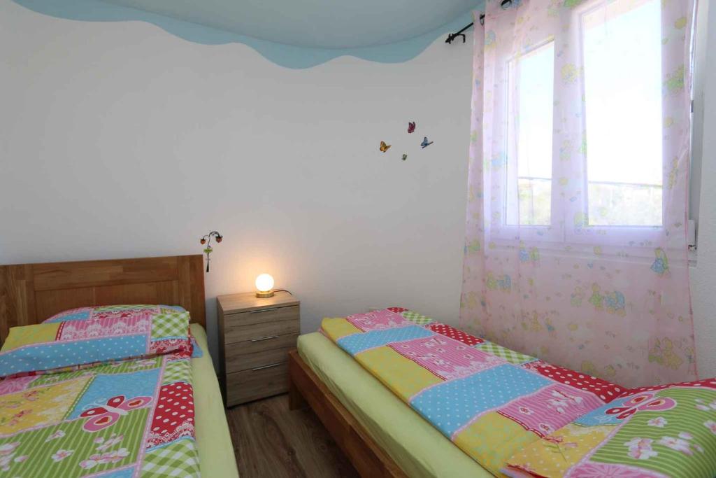 Posteľ alebo postele v izbe v ubytovaní Apartment in Silo/Insel Krk 13586