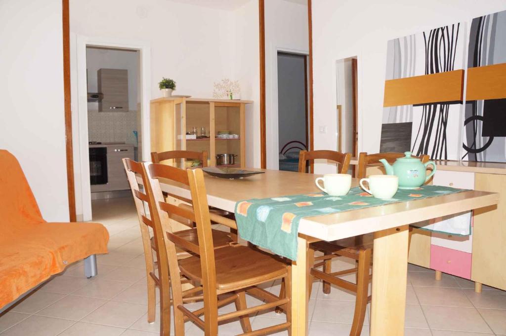 A kitchen or kitchenette at Apartments in Rosolina Mare 25084