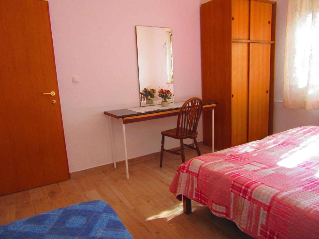Łóżko lub łóżka w pokoju w obiekcie Two-Bedroom Apartment in Pula XI