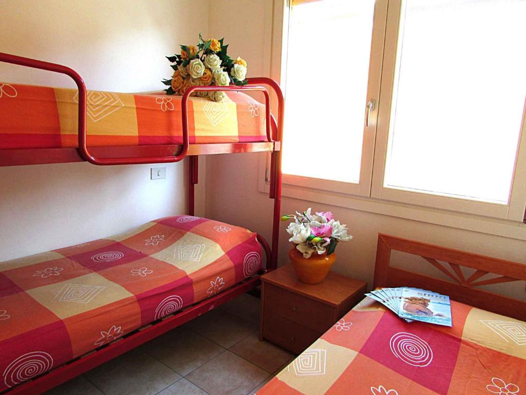 A bed or beds in a room at Apartment in Bibione 24583