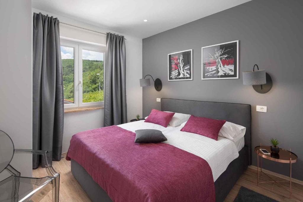 Posteľ alebo postele v izbe v ubytovaní Apartment Rabac 23