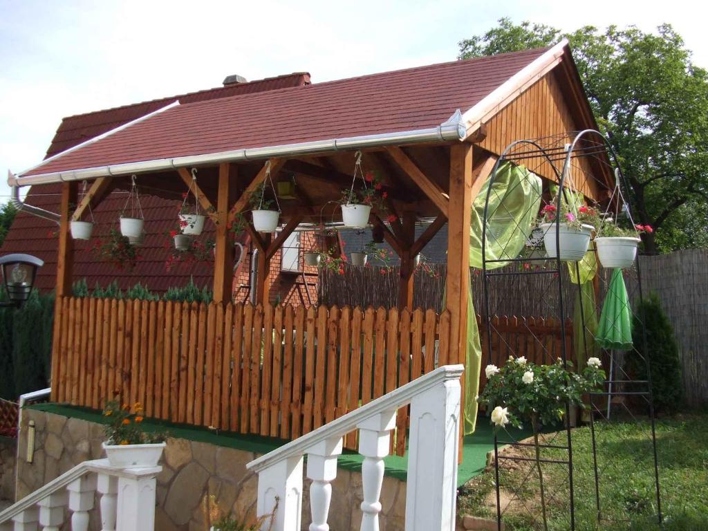 a wooden gazebo with potted plants on it at Studio in Zalakaros/Thermalbad 20679 in Zalakaros