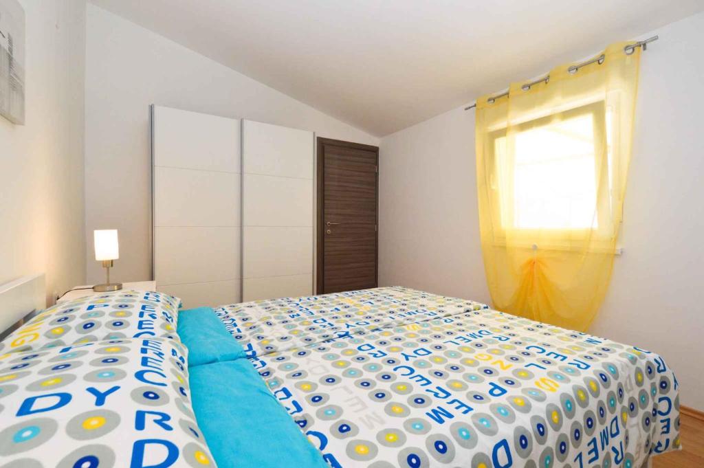 Postel nebo postele na pokoji v ubytování Holiday home Medulin 21