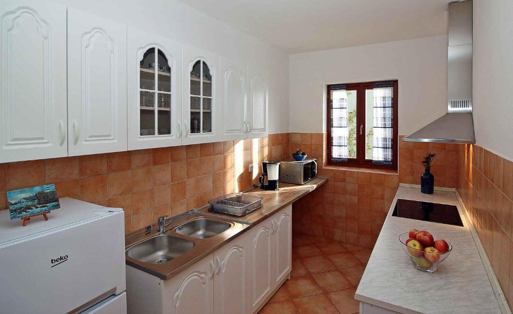 Kuchyňa alebo kuchynka v ubytovaní Apartments in Rabac 16693