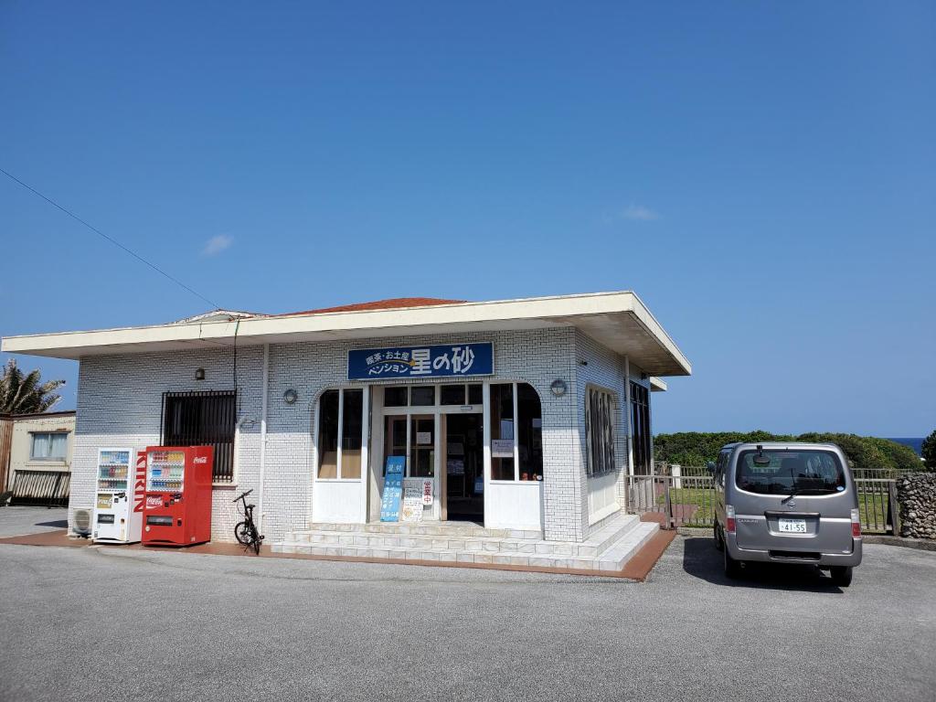 a van parked in front of a gas station at Pension Hoshinosuna in Iriomote