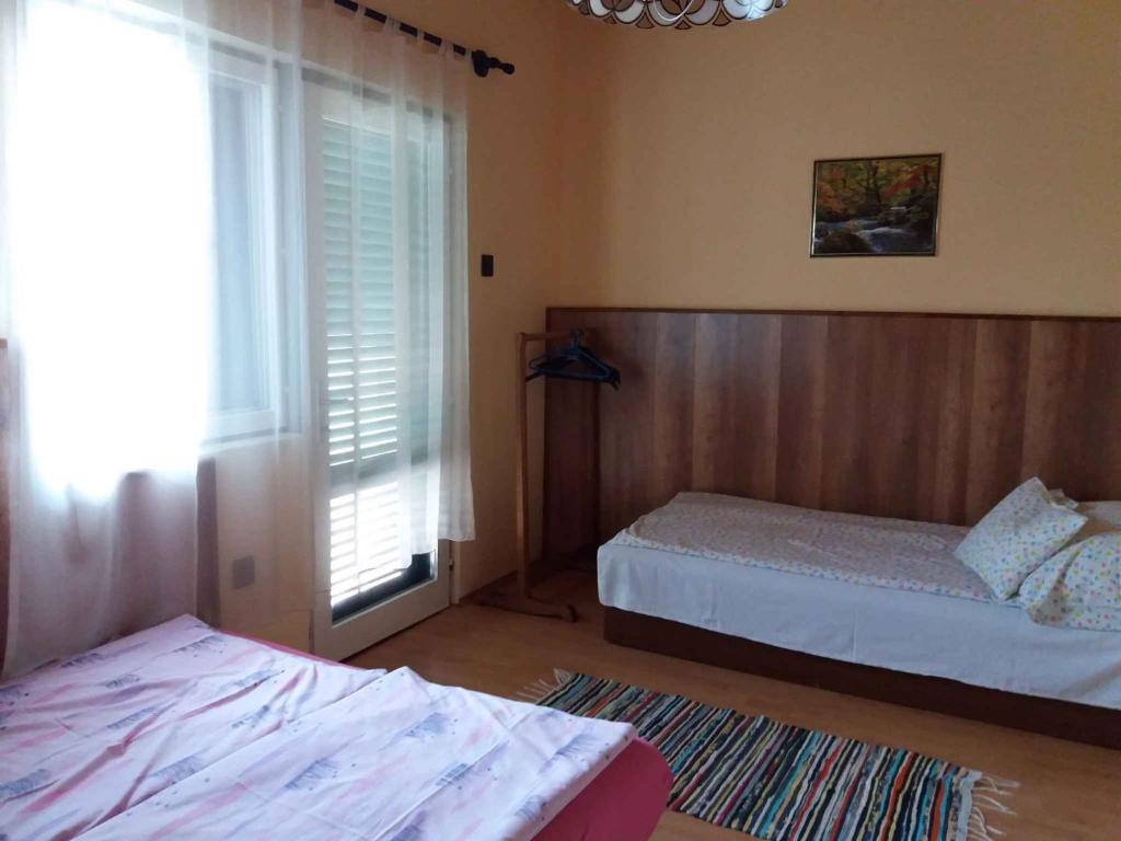 Posteľ alebo postele v izbe v ubytovaní Holiday home in Balatonmariafürdo 33086