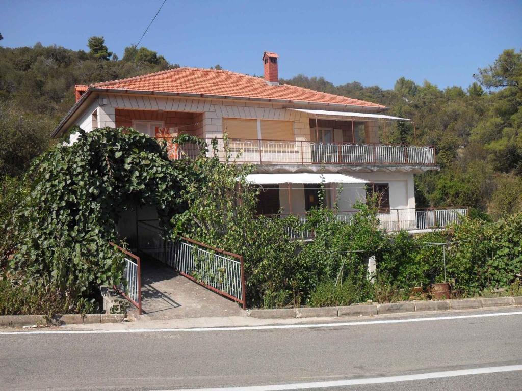 a house on the side of a road at Holiday home Zaglav/Insel Dugi Otok 6296 in Zaglav