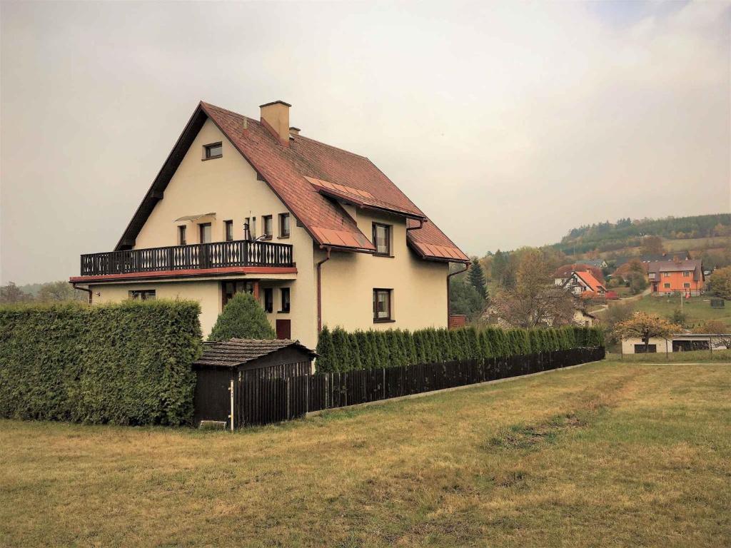a large white house with a red roof at Apartment in Martinice v Krkonosich 2422 in Martinice