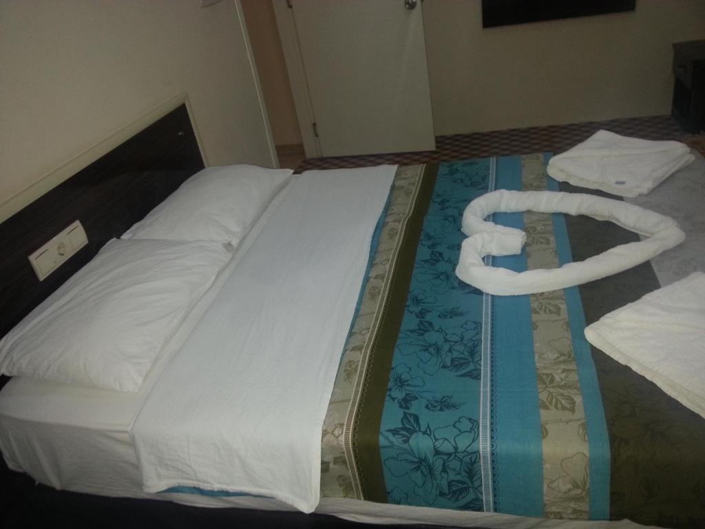 Postel nebo postele na pokoji v ubytování Anatolia Hotel
